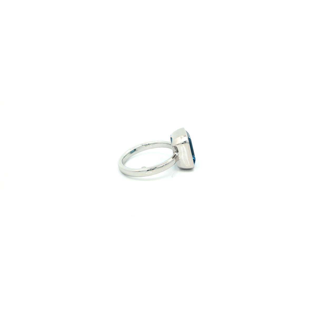 Emerald Cut Blue Topaz Solitaire Ring in White Gold Finish Sterling Silver